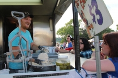 Ben Kleppinger/ben.kleppinger@amnews.com
Michael Chumbley of Russell Springs, left, breads a blooming onion while talking to customers at his food stand.