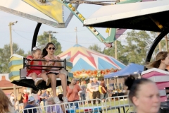 Ben Kleppinger/ben.kleppinger@amnews.com
Fairgoers swing toward the ground on a ride Friday evening.