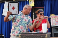 Ben Kleppinger/ben.kleppinger@amnews.com
Comedic magician Mark Comley, left, instructs Marie Claunch of Harrodsburg to point a hand mixer at an audience member and turn the crank in order to transmit the name of her card. Unbeknownst to Claunch, Comley offers the audience member a clue at the same time.
