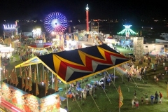 Ben Kleppinger/ben.kleppinger@amnews.com
The Boyle County Fair midway is seen lit up from the top of a ferris wheel Friday night.