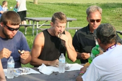 Kendra Peek/kendra.peek@amnews.com 
From left, Travis Watson, Derek Braymer, Gary Chidester and Anthony Redford face off in the final round of the Moon Pie eating challenge Wednesday night; Watson won by eating two the fastest.