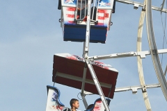 Riders on the farris wheel look over the fairgrounds before the sun set Tuesday evening.