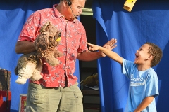 Elijah Cline, 7, of Danville laughs at a magic trick that Mark Comley just performed with his puppet dog during a show at the Boyle County Fair Tuesday night. Comley will be performing two magic shows every night during the fair and is included with the price of admission.