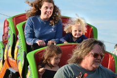 Danielle Arvin and her daughter Bayleigh Smith enjoy a thrill on the small roller coaster at the Boyle County Fair Tuesday evening.