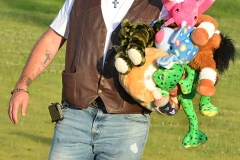 Jason Netherton, of Stanford, has an armful of stuffed animals he won at the midway games Tuesday night at the Boyle County Fair.