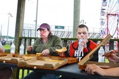 From left, Keyla Peach, of Harrodsburg, Stacey Carter and Nick Rigney, both of London, and Lincoln Lutz were the only competitors in the pizza eating contest Wednesday evening. Peach won $10 by eating the most pizza within two minutes.